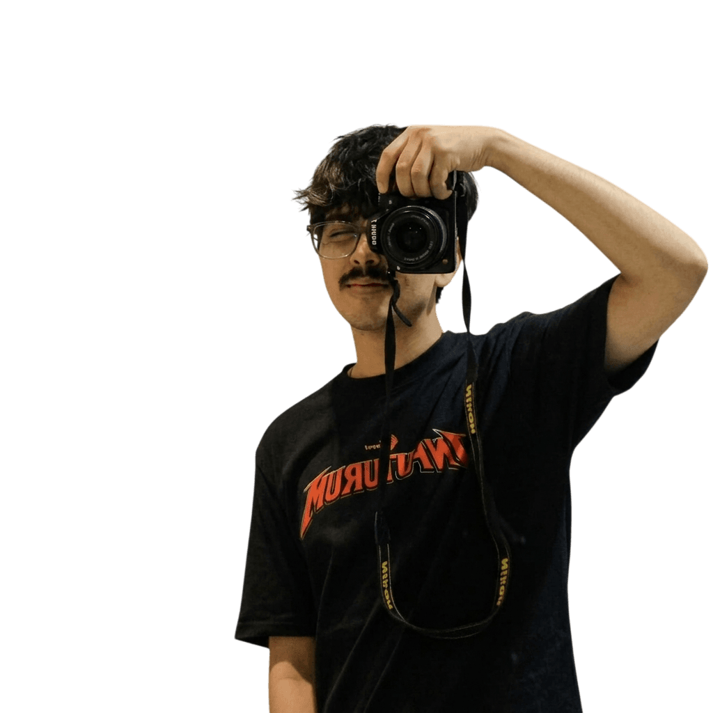 Dhruv Gupta taking a photograph with a Nikon camera